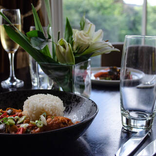 The Padarn Restaurant at the Royal Victoria Hotel Llanberis set for dinner service with elegant table settings.