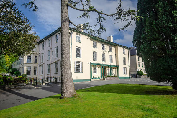 Exterior view of the Royal Victoria Hotel in Llanberis, a historic country house hotel set within landscaped gardens.