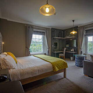 The Slate Room at the Royal Victoria Hotel Llanberis featuring a modern ensuite and soft furnishings.